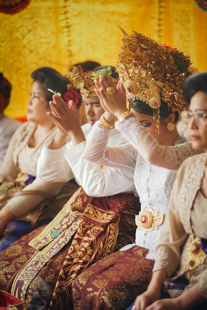 who-we-are Vibrant traditional ceremony in Jakarta with people in cultural attire celebrating.